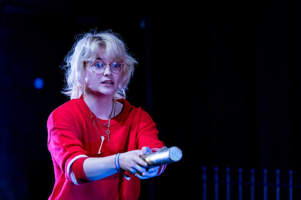 Photo of a girl performing holding her arms out in front of her